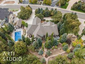 Aerial view of property and surrounding area with a pool area