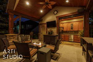 Dining area with high vaulted ceiling, ceiling fan, wooden ceiling, light colored carpet, and recessed lighting