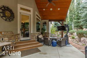 View of patio featuring ceiling fan and entry steps