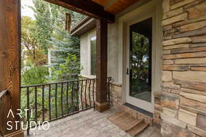 Property entrance with stone siding