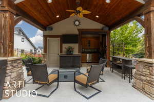 View of patio / terrace with an outdoor fire pit