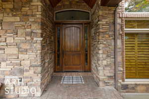 Property entrance with stone siding