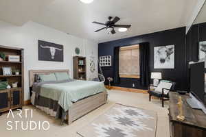 Bedroom featuring carpet and ceiling fan