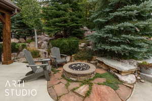 View of patio / terrace featuring an outdoor fire pit