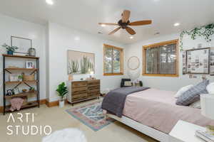Carpeted bedroom with recessed lighting and ceiling fan