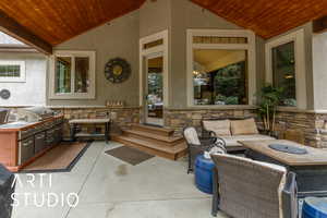 View of patio featuring area for grilling and an outdoor living space