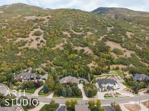 Aerial view of residential area featuring a mountainous background