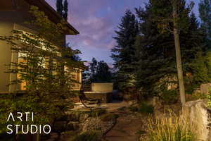 Property exterior at dusk with a patio
