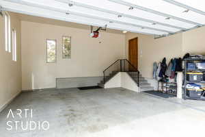 Garage featuring a garage door opener