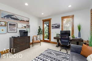 Carpeted office space featuring recessed lighting and baseboards