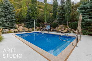 Outdoor pool featuring a patio area
