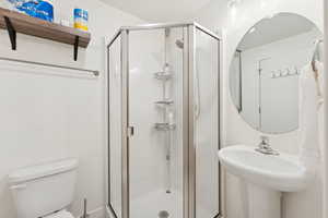 Bathroom with toilet and a shower stall