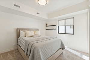 Carpeted bedroom with baseboards