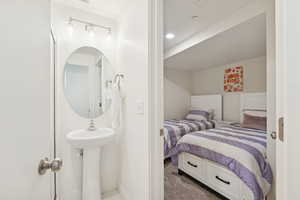 Carpeted bedroom featuring baseboards and recessed lighting