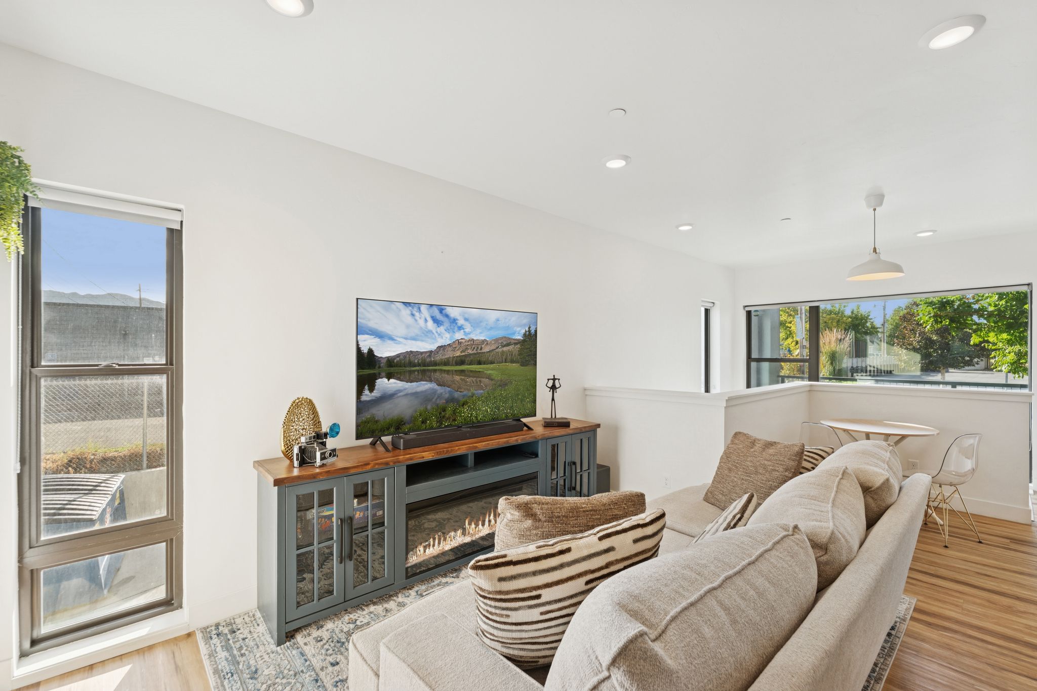 Living room with wood finished floors and recessed lighting