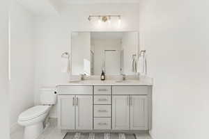 Bathroom with double vanity and a shower stall