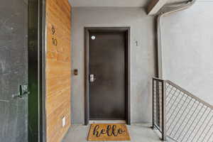 Doorway to property with stucco siding