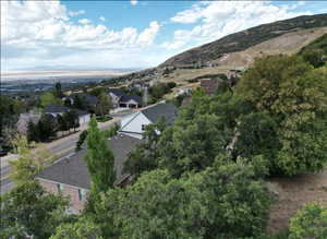 Aerial view of property's location with a mountainous background