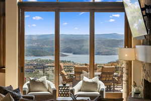 Sitting room featuring plenty of natural light and a fireplace