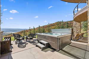 View of patio / terrace with a hot tub