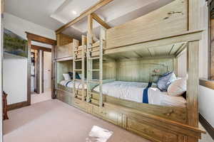 Bedroom featuring carpet flooring and baseboards