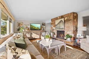 Living Room Featuring Double Sided, Wood Burning Fireplace