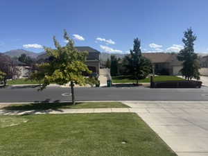 View of home's community featuring a yard