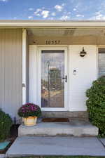 Entrance to property with brick siding