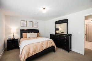 Carpeted bedroom with baseboards