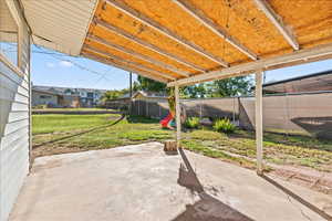 Covered patio with view into the fully fenced yard
