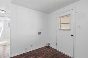 Laundry area featuring hookup for a washing machine near the door leading to the carport