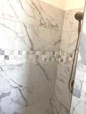 Bathroom view of a tile shower