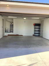 Garage with water heater and a garage door opener