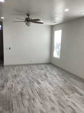 Dining area with recessed lighting, ceiling fan, light wood-style flooring, and a textured ceiling