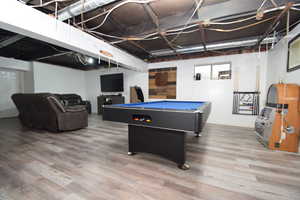 Recreation room featuring pool table and light wood-style flooring