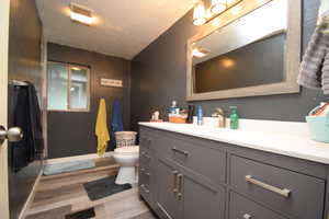 Bathroom featuring light wood-style flooring and vanity