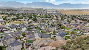 View of property location with a mountainous background and nearby suburban area