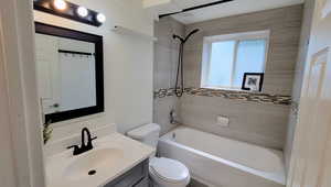 Bathroom featuring shower / bathtub combination and vanity