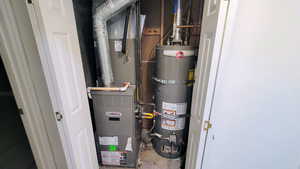 Utilities featuring water heater and heating unit
