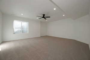 Spare room featuring light carpet, recessed lighting, and a ceiling fan