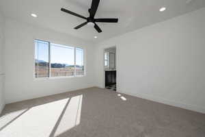 Unfurnished bedroom featuring carpet floors, a ceiling fan, recessed lighting, and connected bathroom