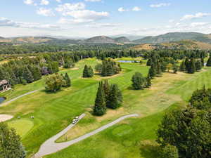 Bird's eye view of a water and mountain view and a local golf course