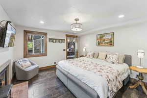 Bedroom with hardwood / wood-style flooring and recessed lighting
