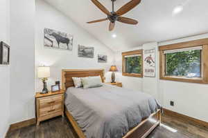 Bedroom with lofted ceiling, dark wood-style floors, recessed lighting, and ceiling fan