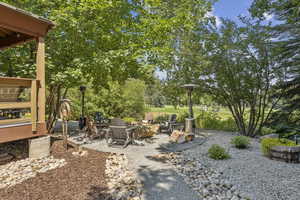 View of yard with a patio and an outdoor fire pit