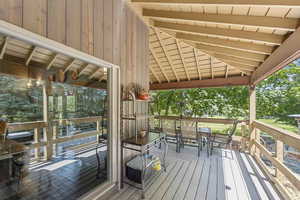 Wooden deck featuring outdoor dining space
