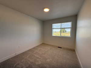 Empty room featuring carpet flooring