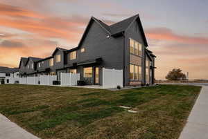 View of side of home featuring a cooling unit
