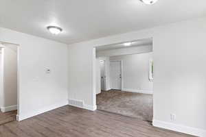 Main level dining room with view to living room