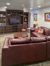 Living area featuring carpet floors and recessed lighting
